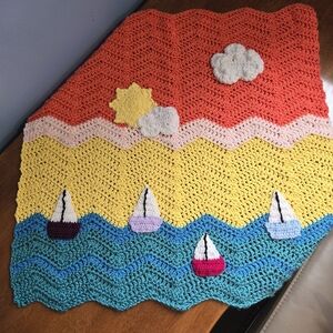 Colorful Crochet Blanket with Sailboat Design